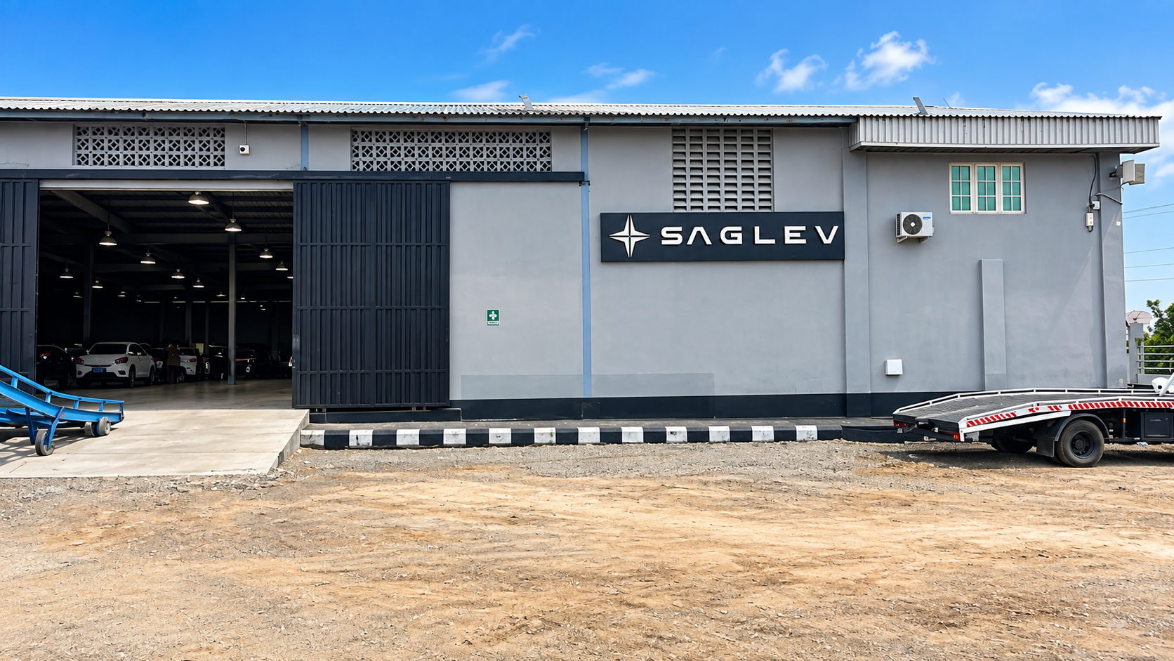 SAGLEV electric vehicle factory production line with vehicles on the assembly line, industrial equipment and skilled operators